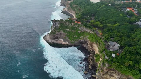 Aerial View of waves and cliff at near Uluwatu temple Bali Stock Footage 312743630