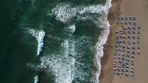 Aerial view of waves and empty beach in the morning. Stock Footage 144592168