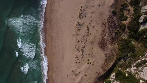 Aerial view of waves at beach and mountains Stock Footage 144591785