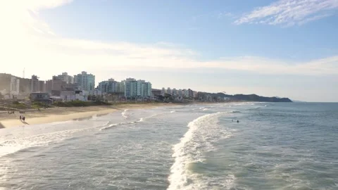 Aerial view of waves at brava beach during scenic sunset, Itajaí, Brazil. Stock Footage 158574153