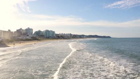 Aerial view of waves at brava beach during scenic sunset, Itajaí, Brazil. Stock Footage 158574167