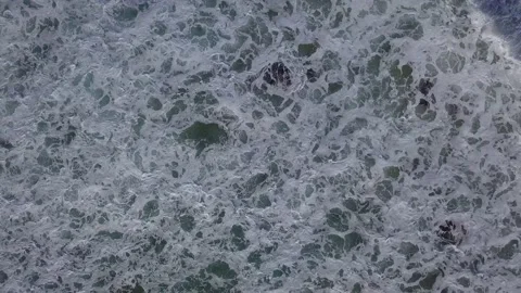 Aerial view waves break Stock Footage 132796220