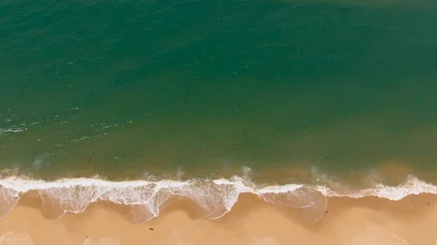 Aerial View Waves Break On Sand Beach With People Stock Footage 99020361