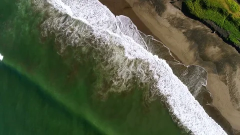 Aerial view waves break on white sand beach Stock Footage 84823078
