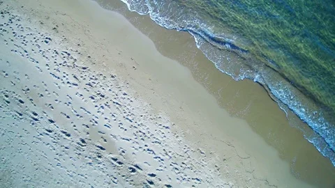 Aerial view waves break on white sand beach Stock Footage 85212090