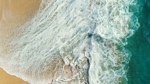 Aerial view waves break on white sand beach. Video stock 86101148