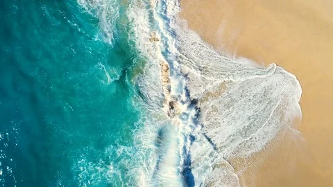 Aerial view waves break on white sand beach 動画素材 86498838