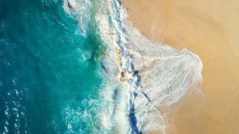 Aerial view waves break on white sand beach. Stock Footage 93718084