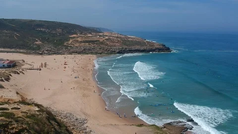 Aerial view waves break on white sand beach Stock Footage 94472506