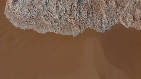 Aerial View Waves Break On White Sand Beach At Sunset Stock Footage 99454243