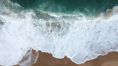 Aerial view waves break on white sand beach Stock Footage 105914367