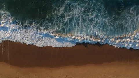 Aerial view waves break on white sand beach Stock Footage 105914636