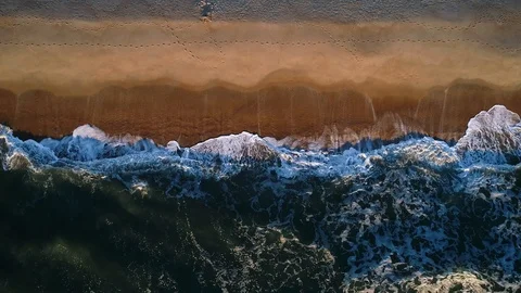 Aerial view of waves breaking on the beach Stock Footage 97820573