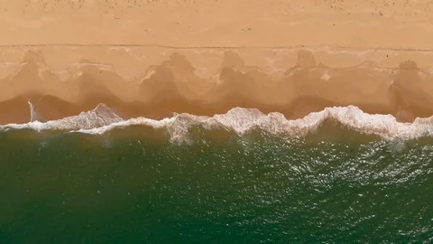 Aerial View Waves Breaking On Golden Sandy Beach Stock Footage 99019849