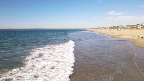 Aerial view of waves breaking in Huntington Beach, California. Stock Footage 166330799