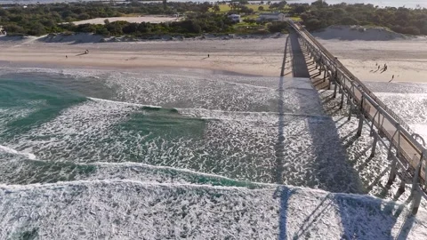 Aerial View of Waves Breaking Near Sand Bypass Jetty at Main Beach Stock Footage 341542472
