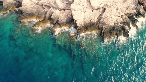 Aerial view of waves breaking into rock shore, Croatia. Stock Footage 126157637