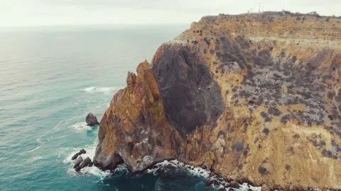 Aerial view of the waves breaking on the rocks in the Black Sea, Cape Fiolent Stock Footage 155656869