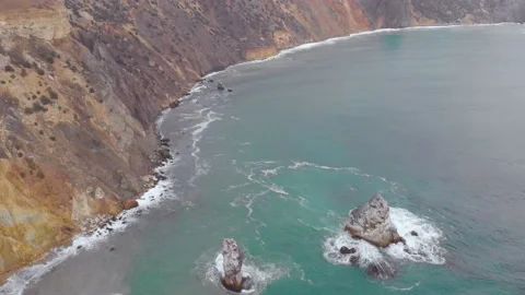 Aerial view of the waves breaking on the rocks in the Black Sea, Cape Fiolent Stock Footage 155710346