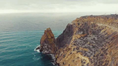 Aerial view of the waves breaking on the rocks in the Black Sea, Cape Fiolent Stock Footage 155766292