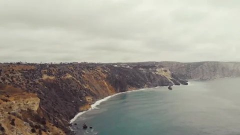 Aerial view of the waves breaking on the rocks in the Black Sea, Cape Fiolent Stock Footage 155766554