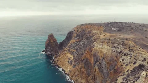 Aerial view of the waves breaking on the rocks in the Black Sea, Cape Fiolent Stock Footage 155817246