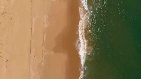 Aerial View Waves Breaking On Sandy Beach Tracking Slowly Stock Footage 99019806