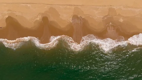 Aerial View Waves Breaking On Sandy Beach Stock Footage 99020034
