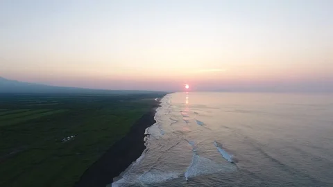 Aerial view of waves breaking on sandy beach. Stock Footage 104198903