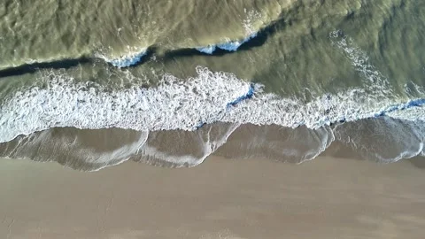 Aerial View of Waves Breaking on a Sandy Beach Along the North Sea Coast Stock Footage 344646888