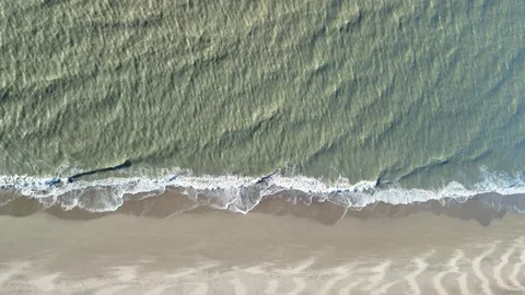 Aerial View of Waves Breaking on a Sandy Beach Along the North Sea Coast Stock Footage 344647064