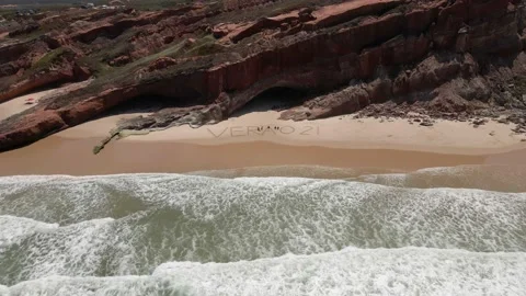 Aerial view of waves breaking on the shore of a Portuguese beach Video stock 170707504