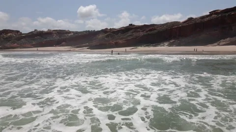 Aerial view of waves breaking on the shore of a Portuguese beach Stock Footage 170707673