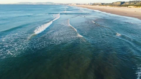 Aerial View of Waves at Costa da Caparica beach, Portugal Stock Footage 145975240
