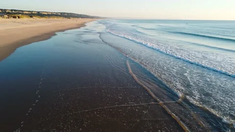 Aerial View of Waves at Costa da Caparica beach, Portugal Stock Footage 146101643