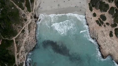 Aerial view waves crash on the beach. Slow motion 4K Video stock 253171621
