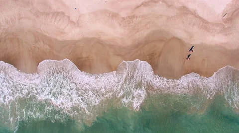 Aerial View of Waves Crashing on Beach in Real Time, 4K Drone Footage Stock Footage