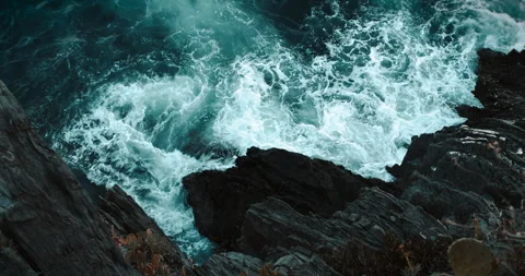 Aerial View of Waves Crashing on Cliffs Stock Footage 313792559