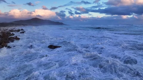 Aerial view of waves crashing on rocks, South Africa. 스톡 동영상 314711126