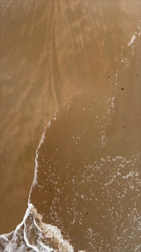 Aerial view on the waves crushing at the beach Video stock 249354979