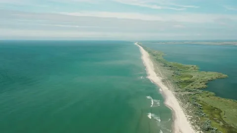 Aerial view of waves on a gritty ocean beach. Stock Footage 223882959