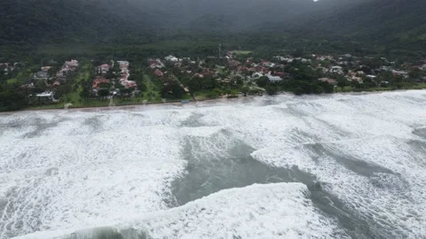 Aerial view of the waves at Guaecá beach in São Sebastião Stock Footage 238463095