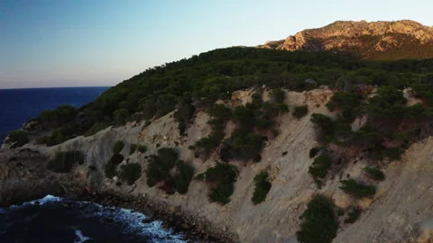 Aerial view of waves hitting a cliff at Mallorca Stock Footage 278304631