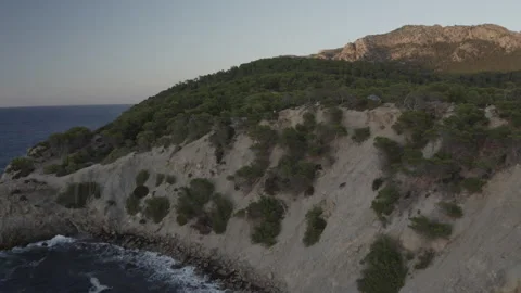 Aerial view of waves hitting a cliff at Mallorca Stock Footage 278304693