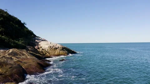 Aerial view of waves hitting estaleiro beach shoreline, Brazil. Stock Footage 158574118