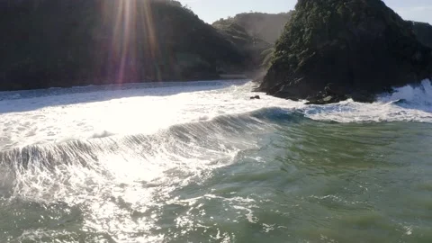 Aerial view of waves hitting at hidden beach during day, Itajaí, Brazil Stock Footage 158574375