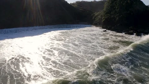 Aerial view of waves hitting at hidden beach during day, Itajaí, Brazil Stock Footage 158574377
