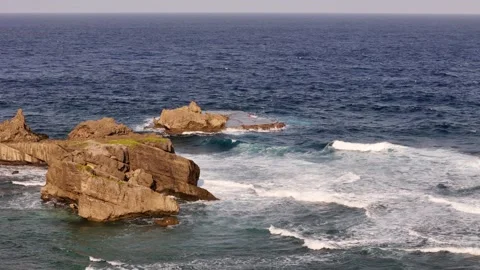Aerial View of Waves Hitting Rocky Shoreline - Majestic Sea Footage Stock Footage 304166967