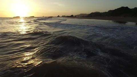 Aerial View of Waves Lapping On The Shore At Sunset 스톡 동영상 71158271