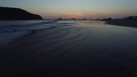 Aerial View of Waves Lapping On The Shore At Sunset 스톡 동영상 71160956